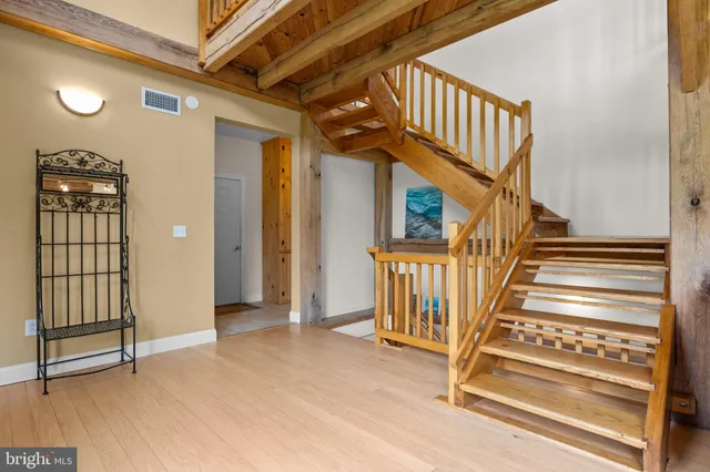 a living room with furniture and a rug