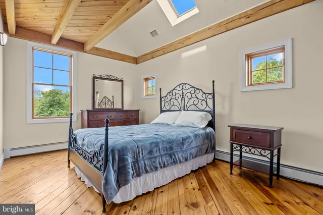 a kitchen with stainless steel appliances granite countertop a sink and a refrigerator