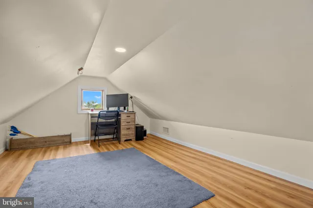 a view of a patio with table and chairs and potted plants