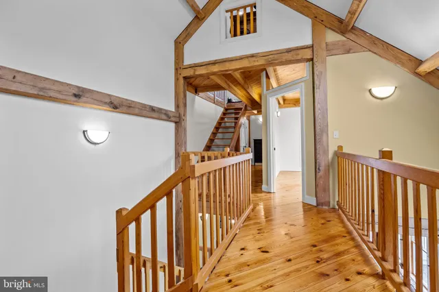 swimming pool view with a garden and seating area