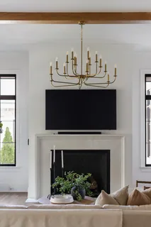 a kitchen with stainless steel appliances a table and chairs