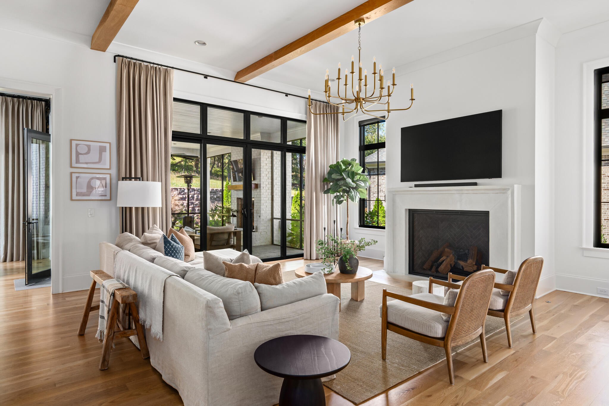 9021 Passiflora College Grove, TN 37046 - Photo 19 of 84 a living room with furniture a fireplace and a flat screen tv