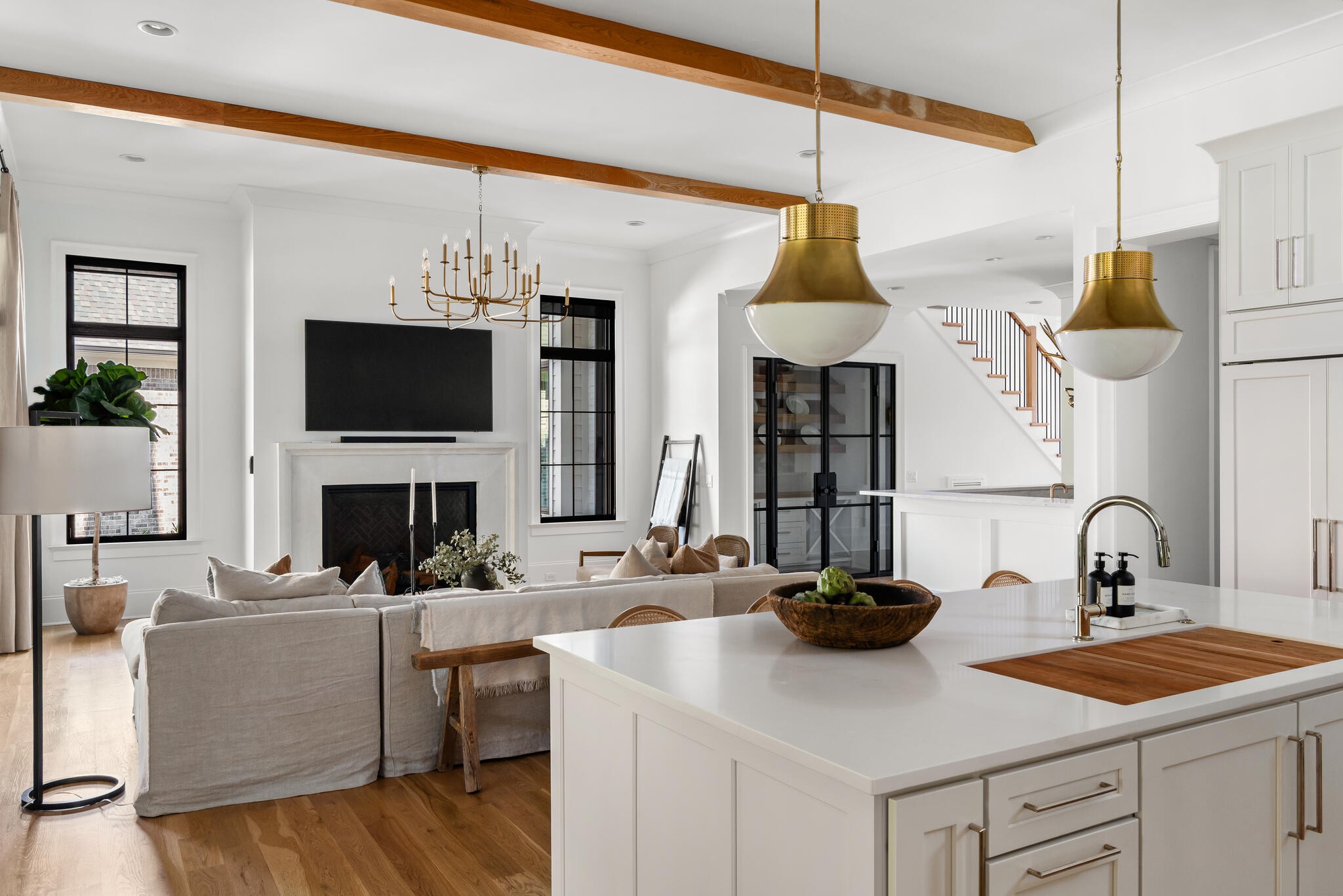 9021 Passiflora College Grove, TN 37046 - Photo 21 of 84 a kitchen with a sink dishwasher a stove top oven a dining table and chairs with wooden floor