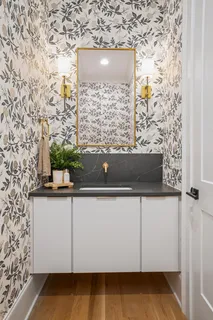 a bedroom with a bed and a chair