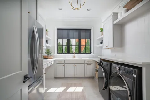 a bathroom with a granite countertop toilet a sink and a mirror