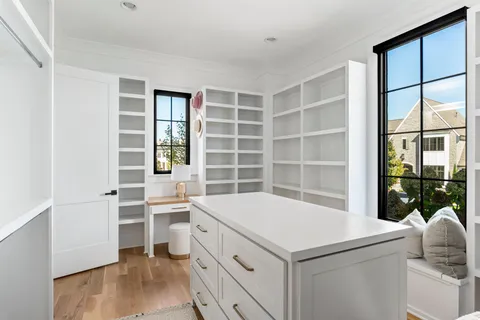 a front view of house with a garden