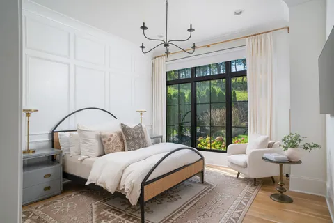 an aerial view of multiple houses with a big yard