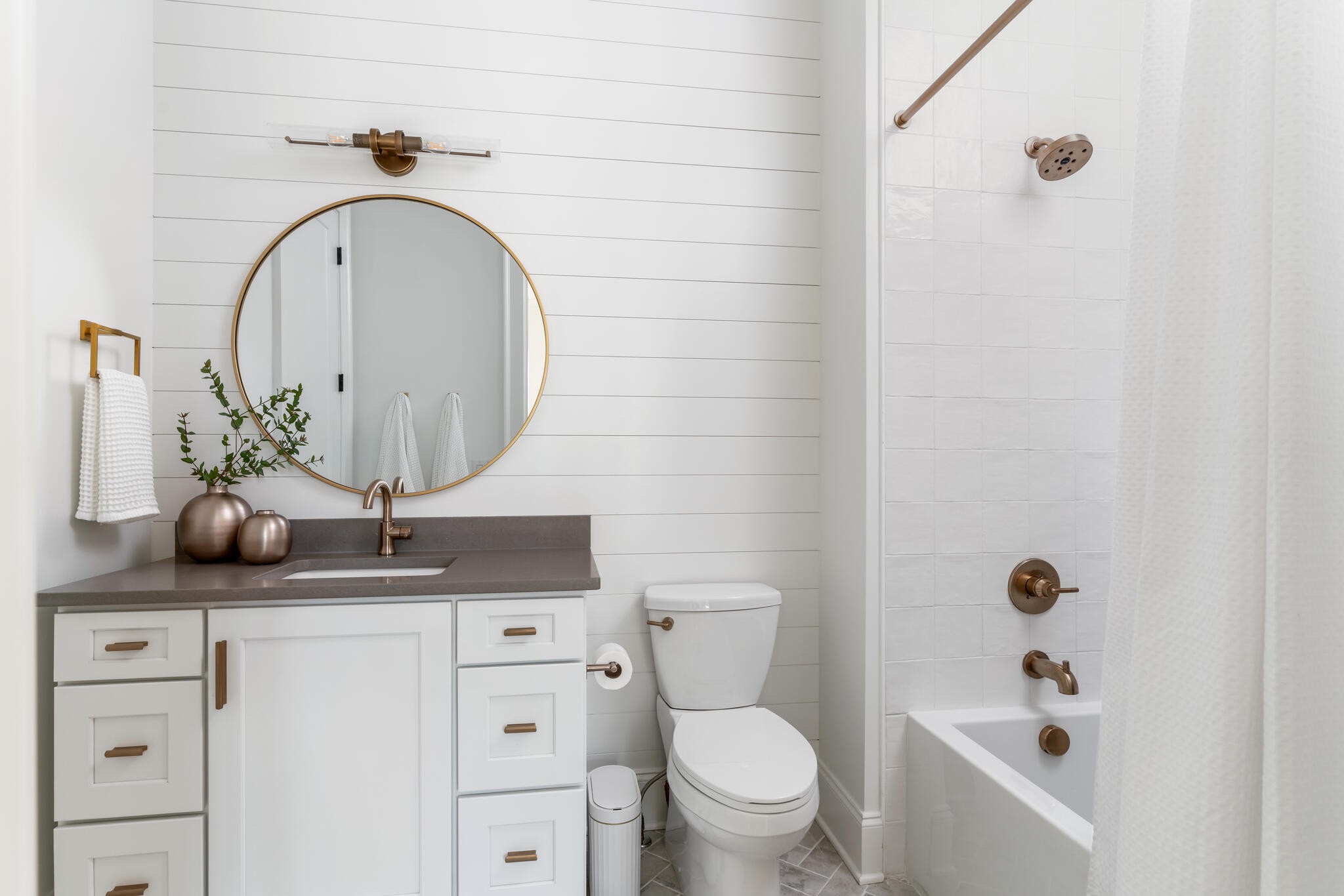 9021 Passiflora College Grove, TN 37046 - Photo 65 of 84 a bathroom with a granite countertop toilet a sink and a mirror