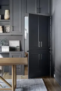 a kitchen with a sink and a potted plant