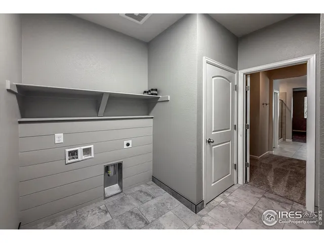 a view of a hallway with seating area