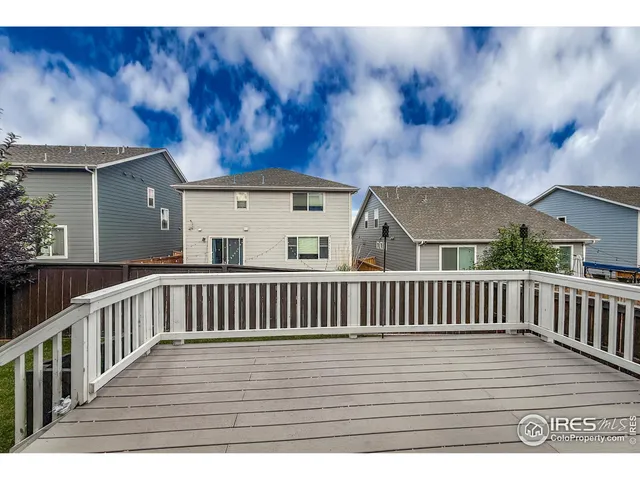 a kitchen with a refrigerator and window