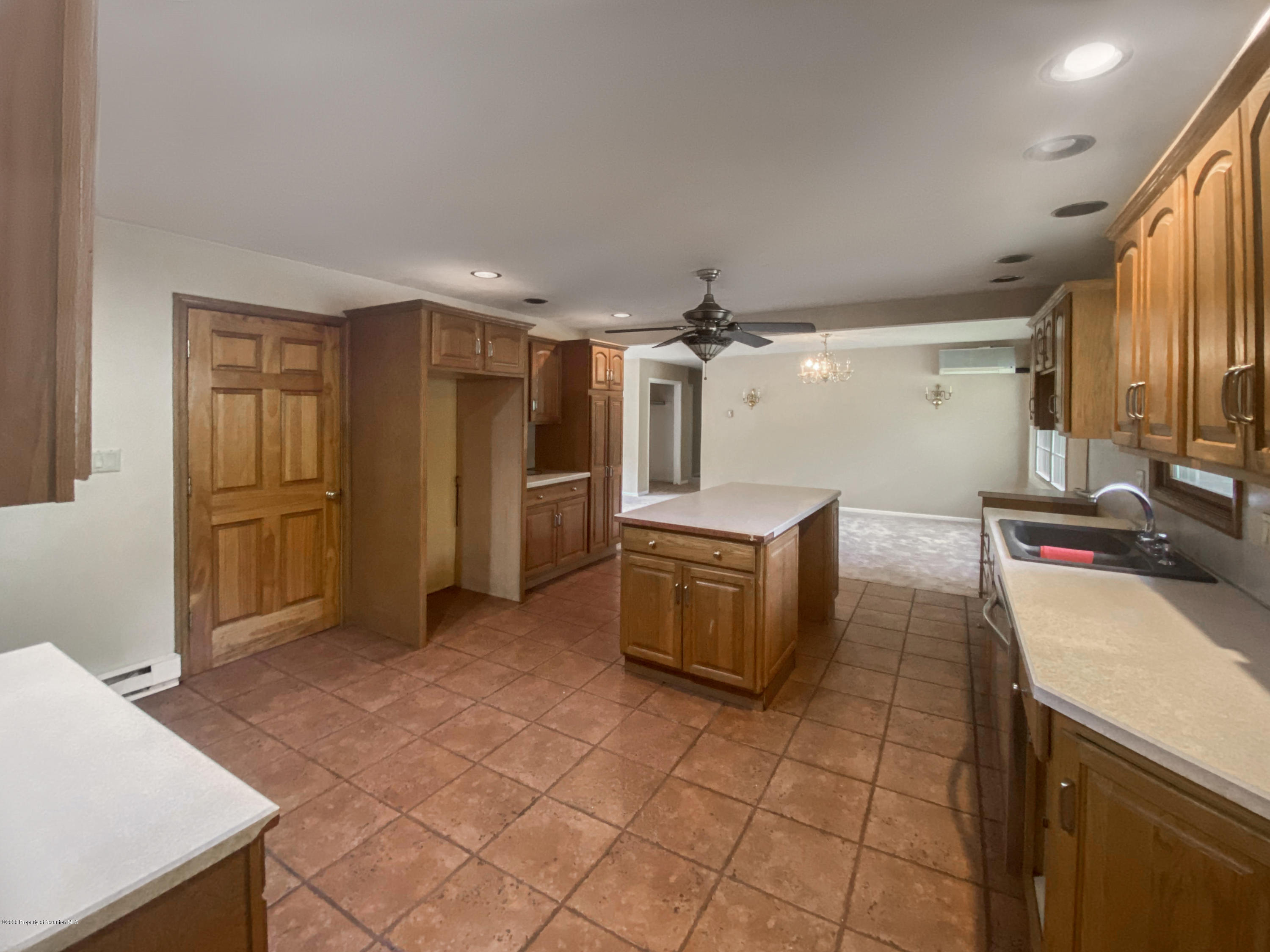 2108 Glendale Road Pittston, PA 18640 - Photo 12 of 32 a kitchen with refrigerator and cabinets