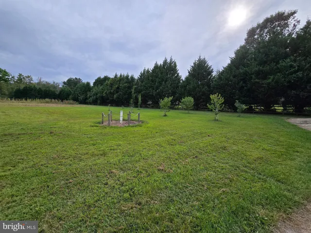 a view of outdoor space with green field in background