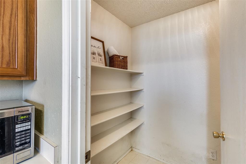 2532 Timberbrook Trail McKinney, TX 75071 - Photo 16 of 32 a view of walk in closet with empty racks