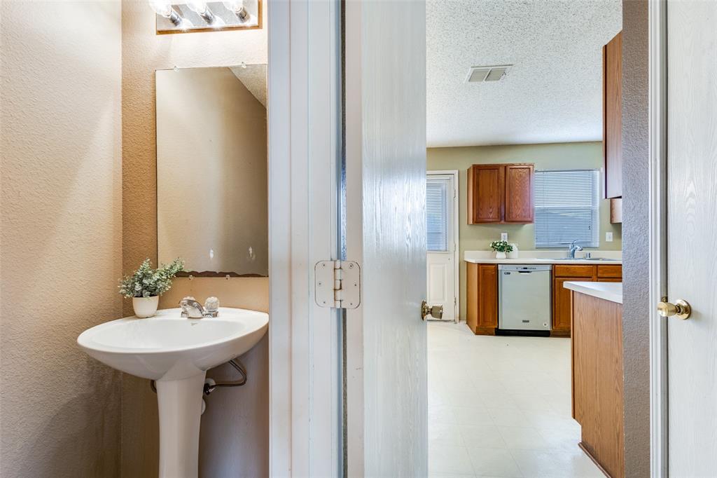 2532 Timberbrook Trail McKinney, TX 75071 - Photo 18 of 32 a bathroom with a sink a mirror and a shower