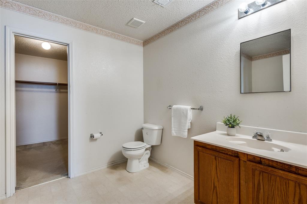 2532 Timberbrook Trail McKinney, TX 75071 - Photo 23 of 32 a bathroom with a sink and a mirror