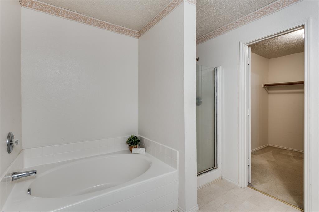 2532 Timberbrook Trail McKinney, TX 75071 - Photo 24 of 32 a white bath tub sitting next to a shower