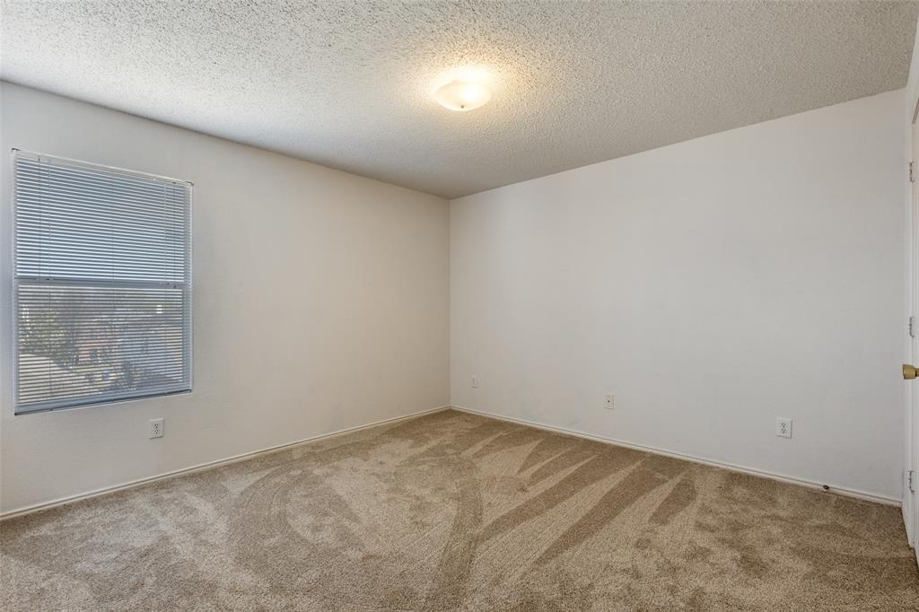 2532 Timberbrook Trail McKinney, TX 75071 - Photo 26 of 32 an empty room with a workbench