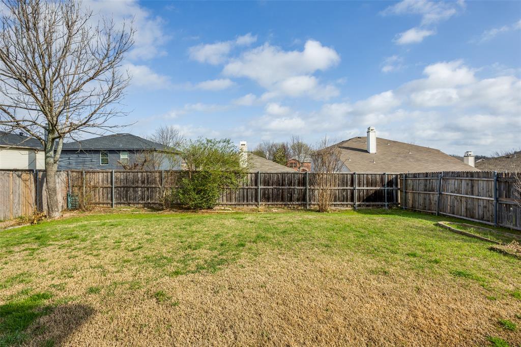2532 Timberbrook Trail McKinney, TX 75071 - Photo 31 of 32 a view of a big yard with large trees and wooden fence
