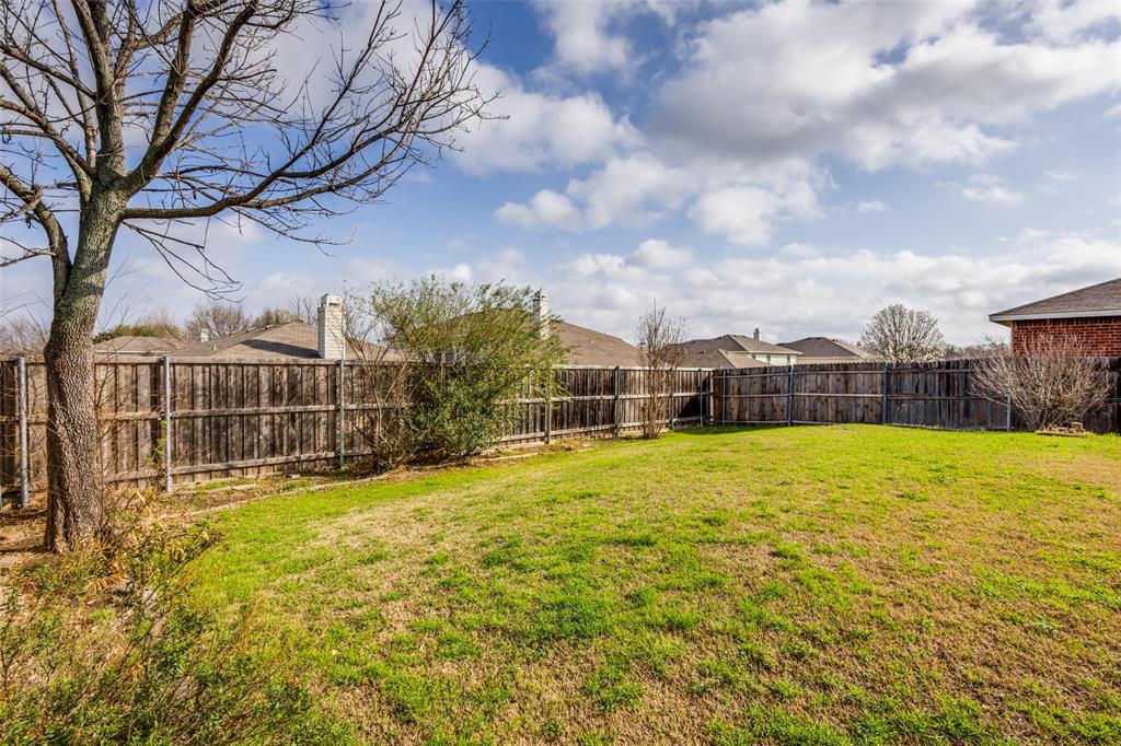 2532 Timberbrook Trail McKinney, TX 75071 - Photo 32 of 32 a view of a swimming pool with a yard and wooden fence