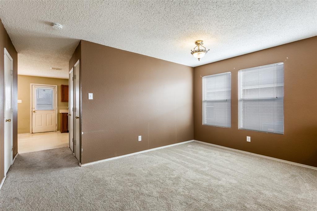 2532 Timberbrook Trail McKinney, TX 75071 - Photo 6 of 32 en empty room with windows and ceiling fan