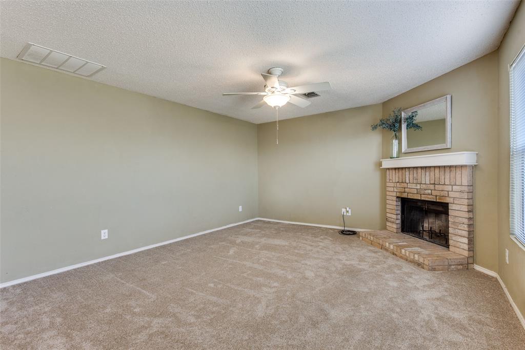 2532 Timberbrook Trail McKinney, TX 75071 - Photo 9 of 32 a view of empty room with a fireplace