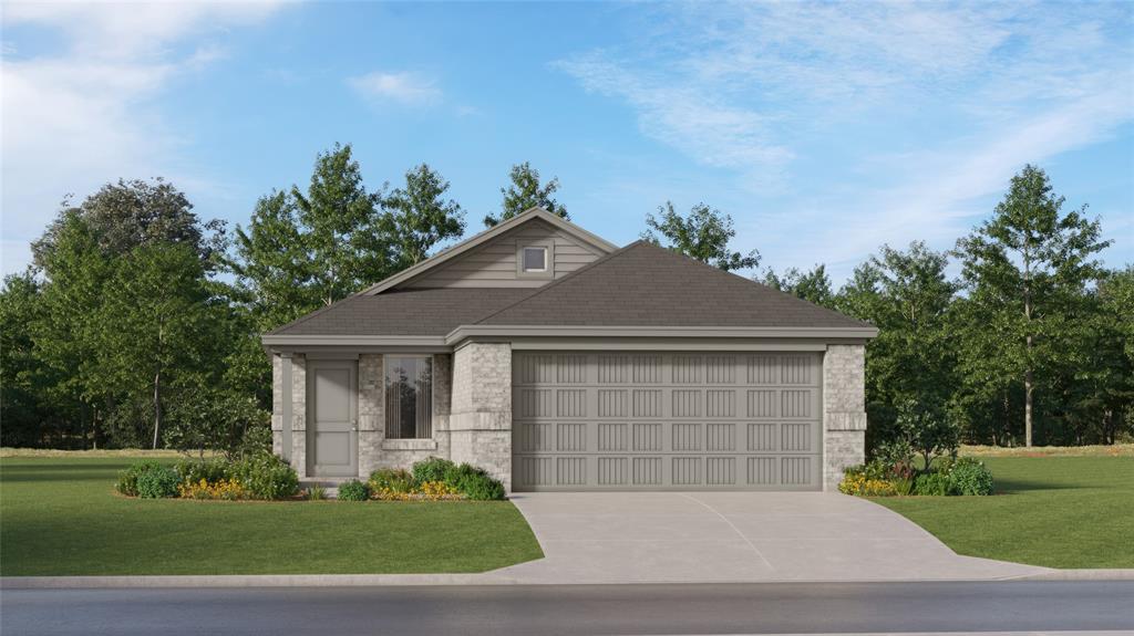 View of front of home featuring a garage and a front lawn