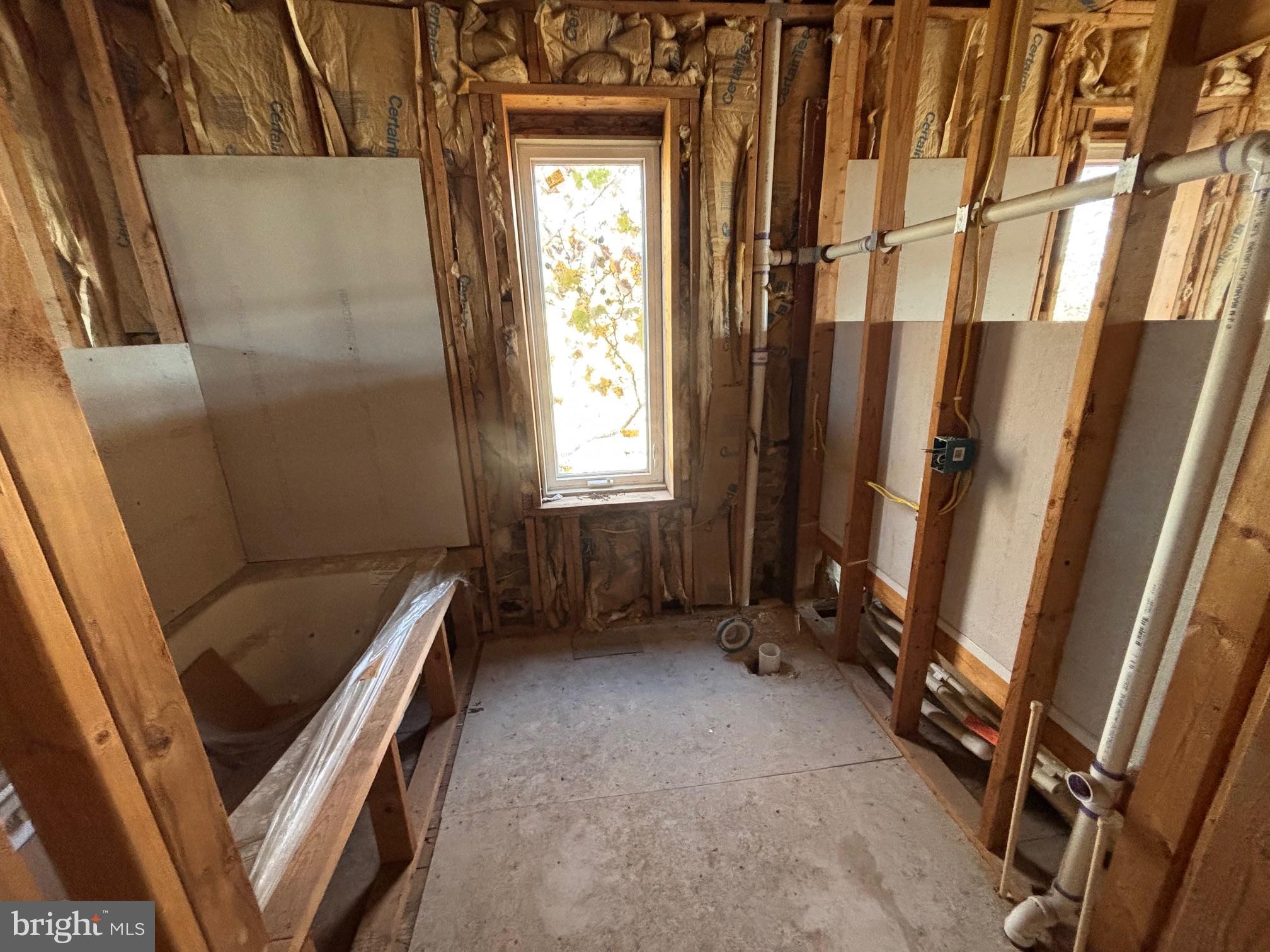 2401 Annapolis Road Baltimore, MD 21230 - Photo 7 of 14 a view of an empty room with wooden floor and a window