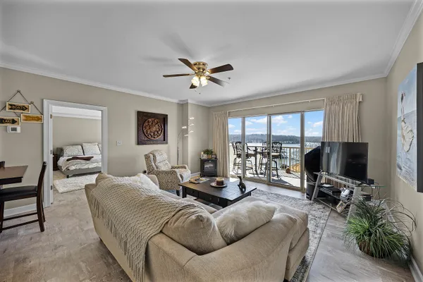a living room with furniture and a large window