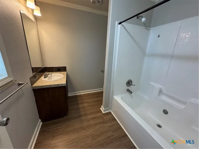 a wooden fence with trees in the background