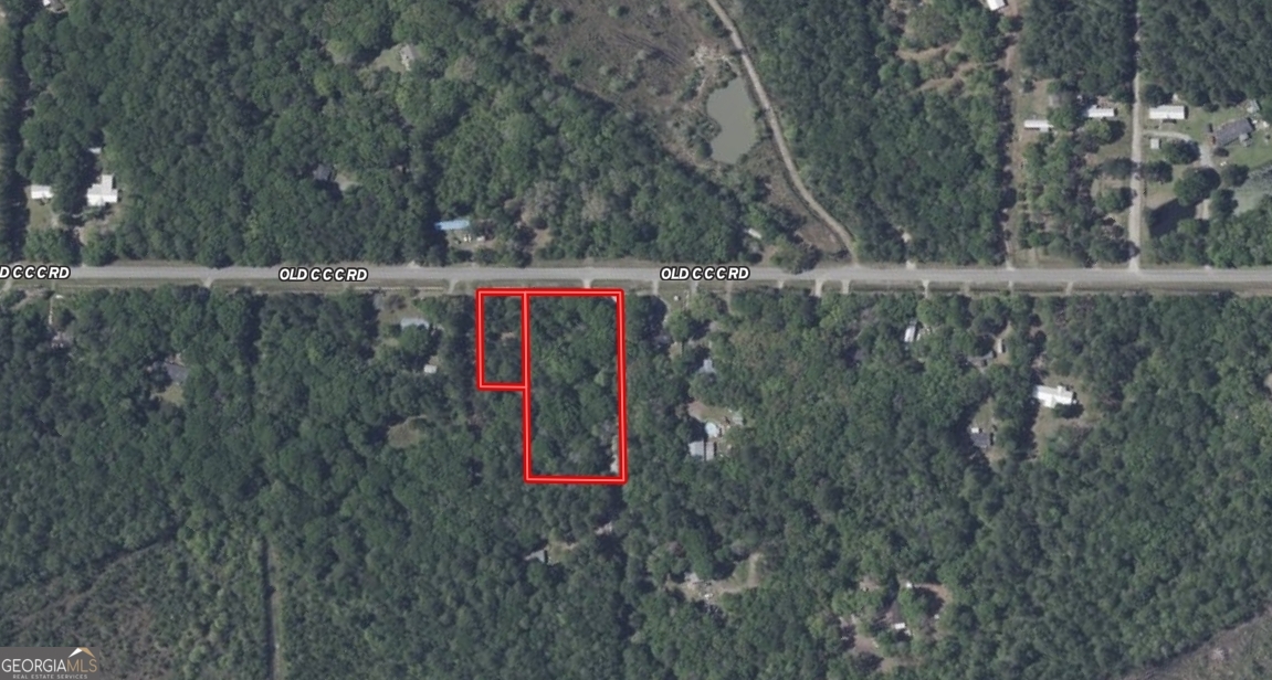 638-628 Old C C C Road Brunswick, GA 31523 - Photo 10 of 10 a flag is sitting in the middle of a yard