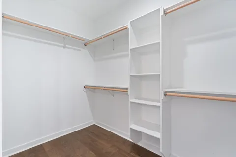 a view of an empty walk in closet