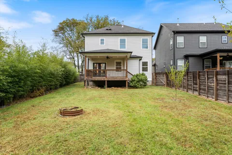 a view of a house with wooden fence