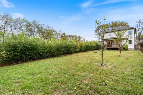 a view of a big yard next to a house
