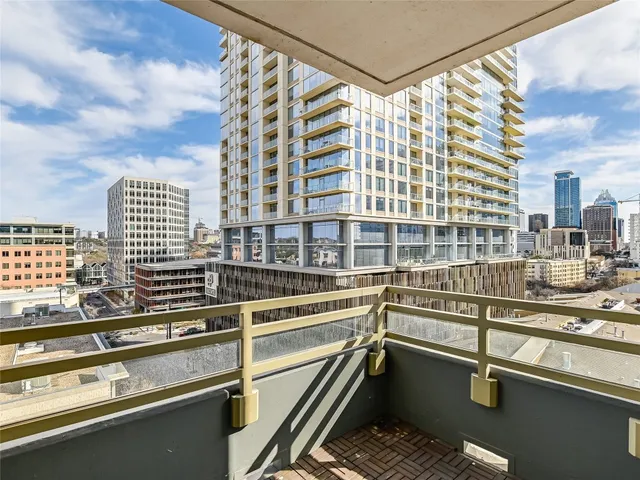 a view of a balcony with city view