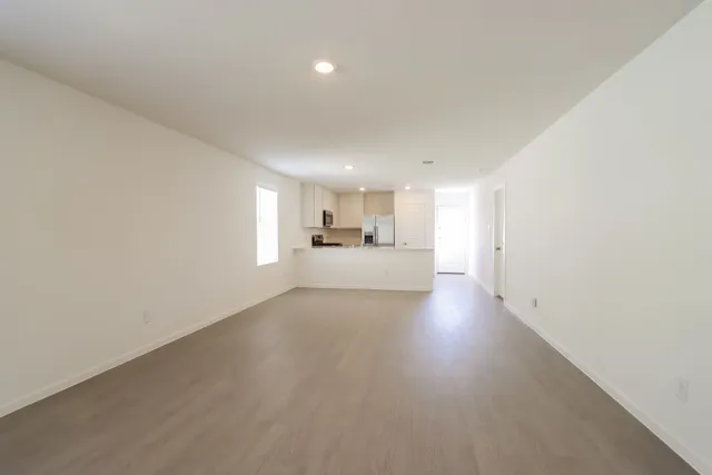 a view of a kitchen with a sink and a window