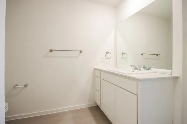 a bathroom with a sink and mirror