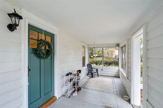 a view of hallway with seating area