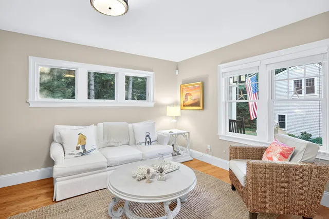 a spacious bedroom with a bed a couch and dresser