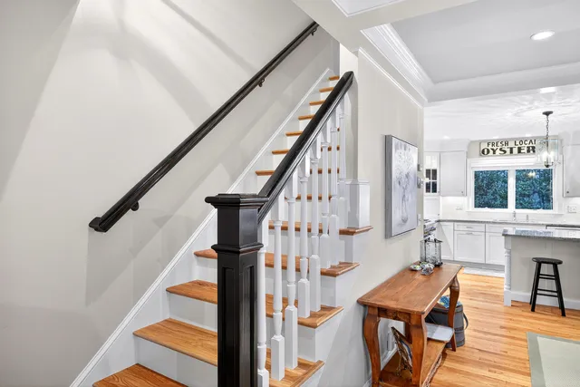 a bathroom with a granite countertop sink a large mirror and shower