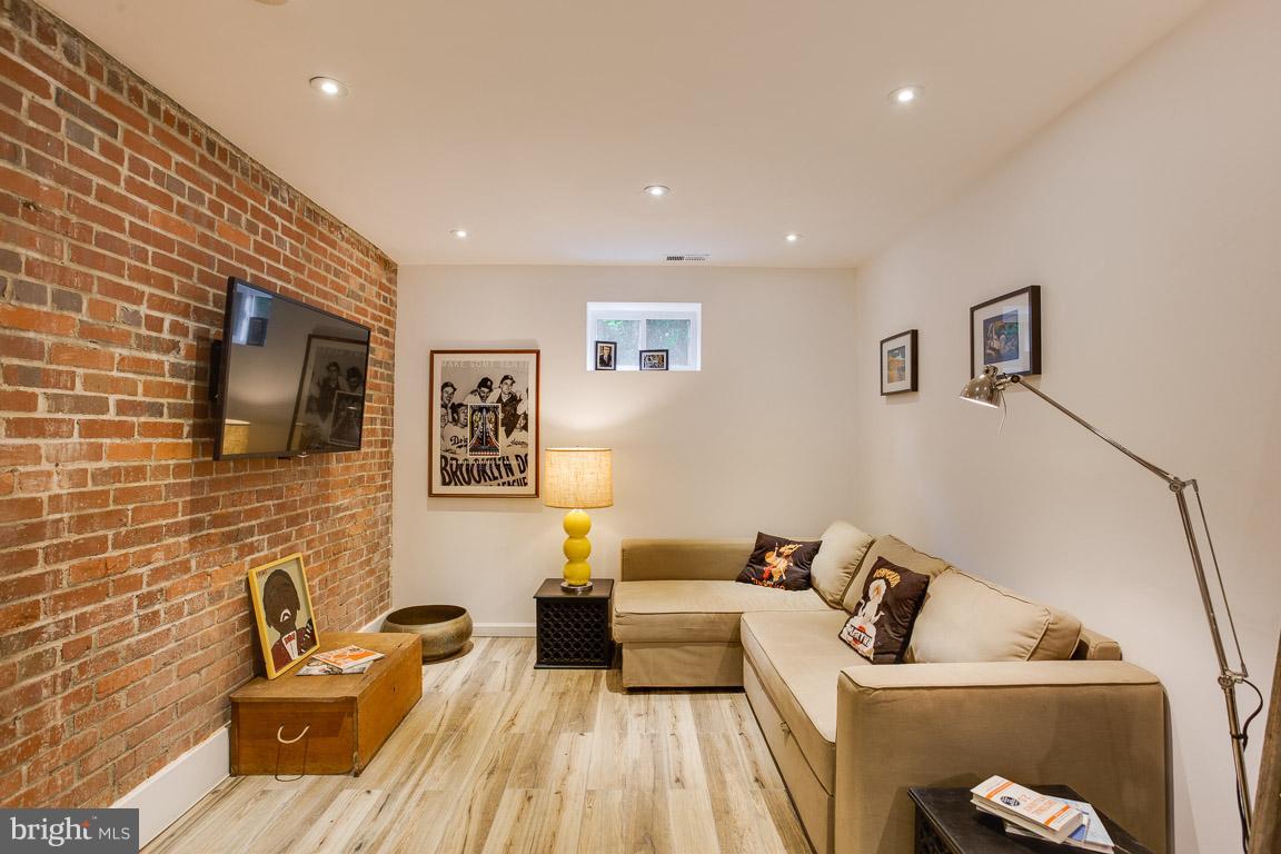 4914 29th Road South, Unit A2 Arlington, VA 22206 - Photo 17 of 30 a living room with furniture and a flat screen tv