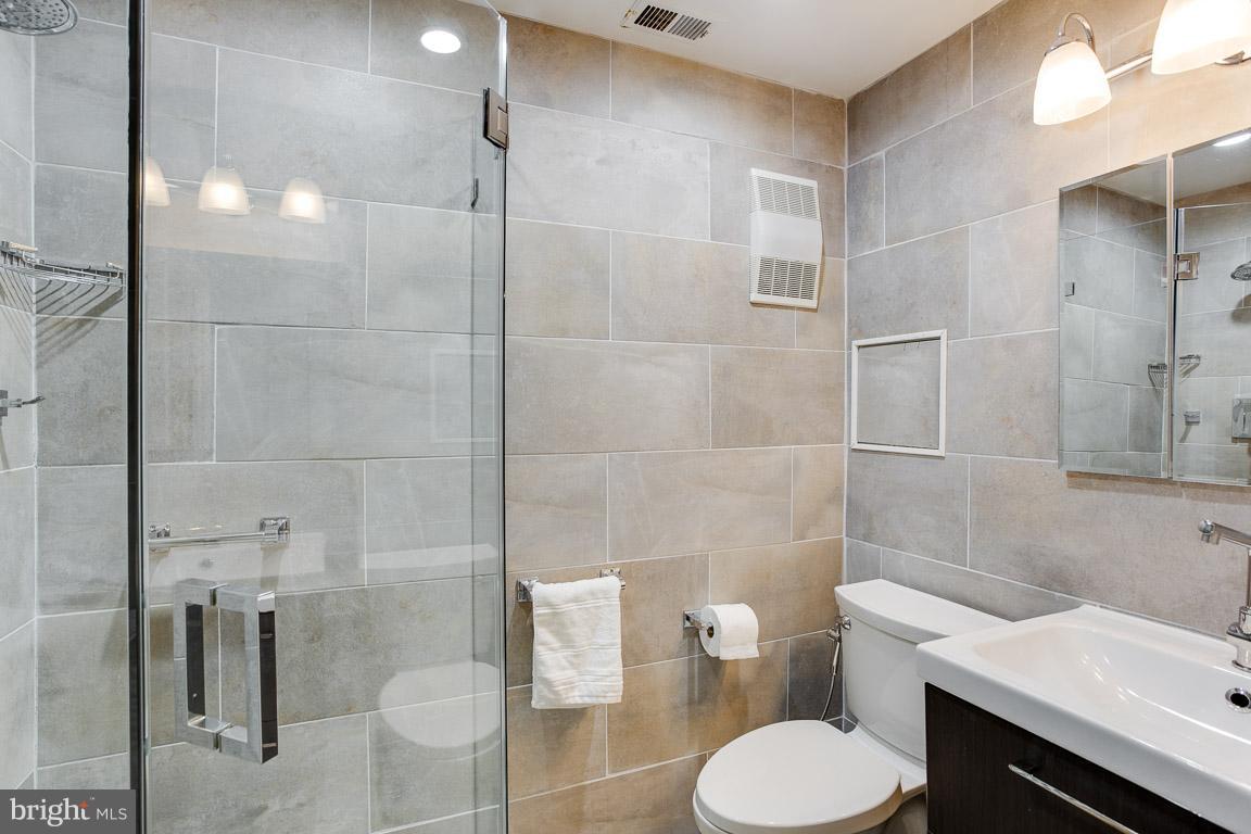 4914 29th Road South, Unit A2 Arlington, VA 22206 - Photo 21 of 30 a bathroom with a toilet and a shower