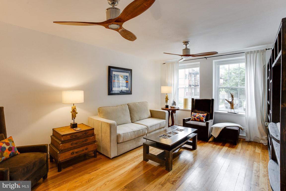 4914 29th Road South, Unit A2 Arlington, VA 22206 - Photo 7 of 30 a living room with furniture a flat screen tv and a window