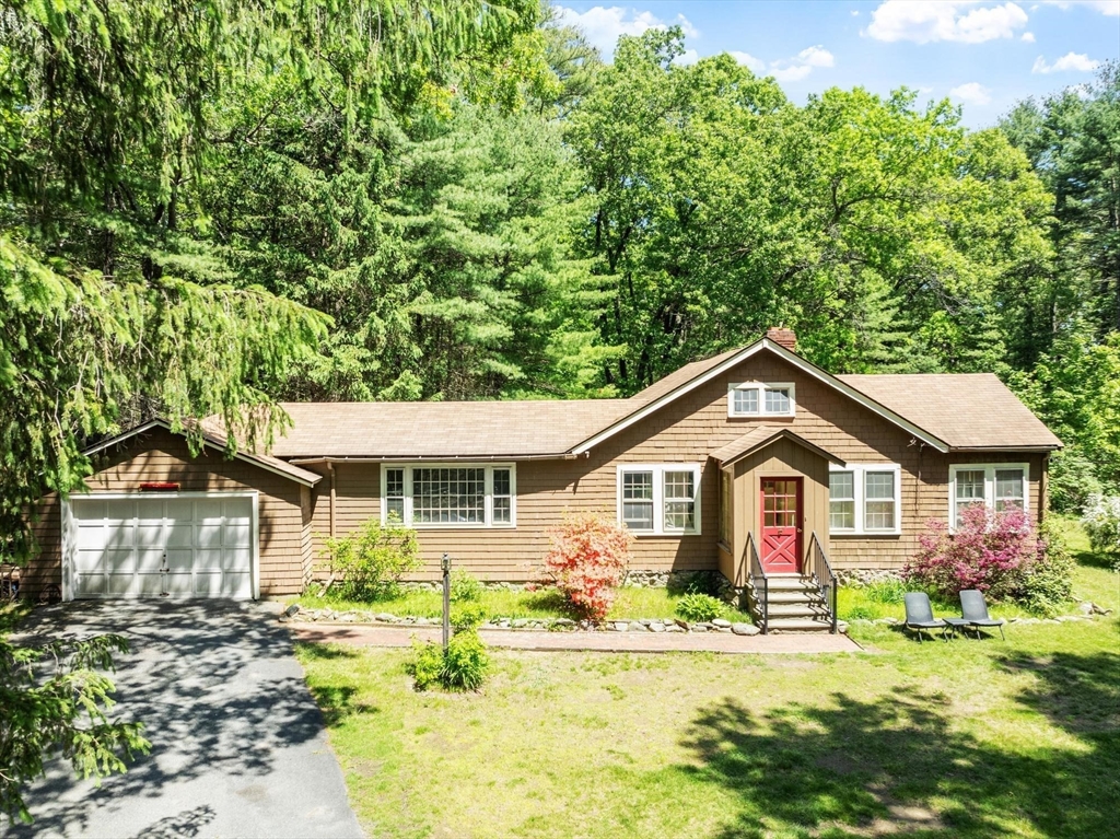38 Rutland Street Carlisle, MA 01741 - Photo 2 of 18 a front view of a house with a yard