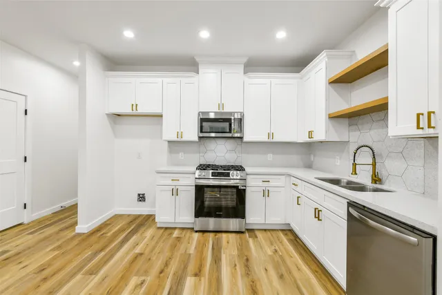 a kitchen with a sink and cabinets