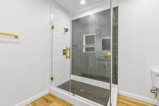 a bathroom with a sink a toilet and bathtub