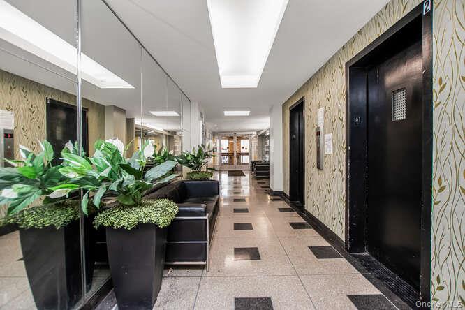 6 Fordham Hill Ovl, Unit 15F Bronx, NY 10468 - Photo 2 of 26 Building lobby with wallpapered walls