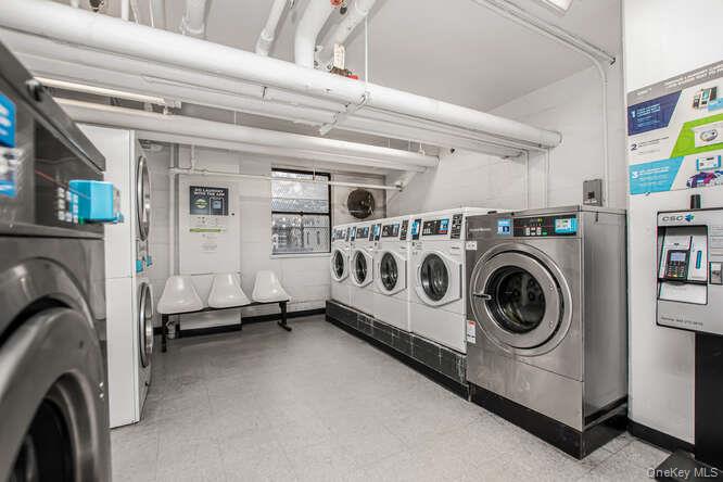 6 Fordham Hill Ovl, Unit 15F Bronx, NY 10468 - Photo 22 of 26 Community laundry room with washer and clothes dryer