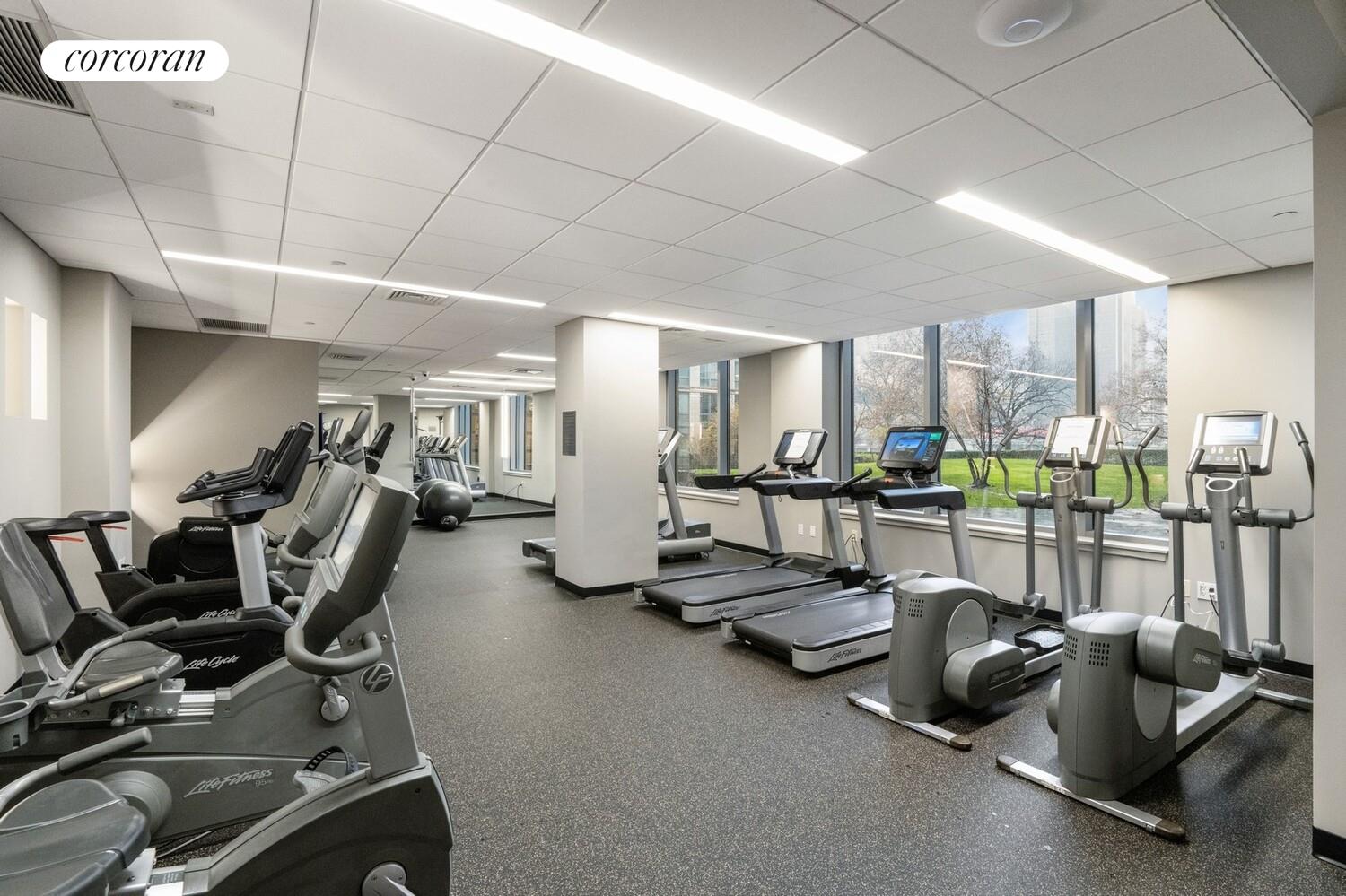 425 Main Street, Unit 15E Manhattan, NY 10044 - Photo 22 of 30 a room with gym equipment
