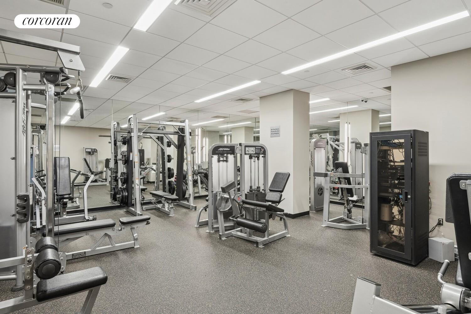 425 Main Street, Unit 15E Manhattan, NY 10044 - Photo 23 of 30 a view of a room with gym equipment